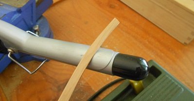 Using a curling iron to shape wood strips