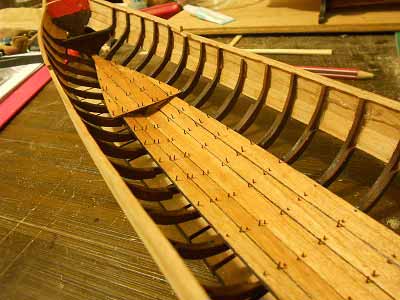 Queen Anne barge laying flooring planks